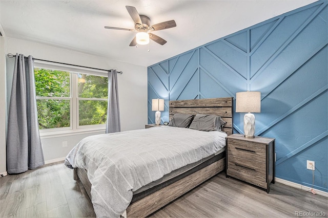 9519 W Coal Mine Ave Unit F, Littleton, CO 80123 - bedroom featuring wood finished floors and ceiling fan