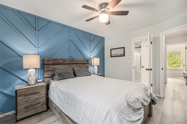 9519 W Coal Mine Ave Unit F, Littleton, CO 80123 - bedroom featuring light wood-style floors and a ceiling fan