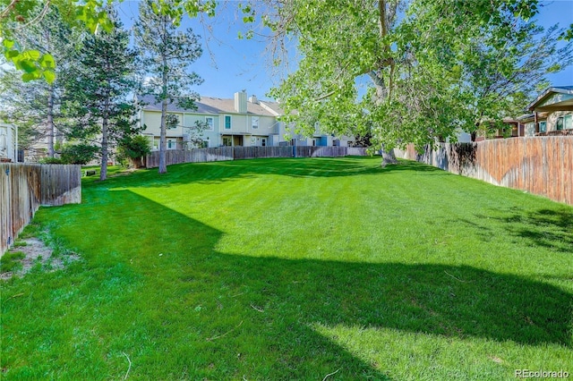 9519 W Coal Mine Ave Unit F, Littleton, CO 80123 - fenced yard featuring a residential view