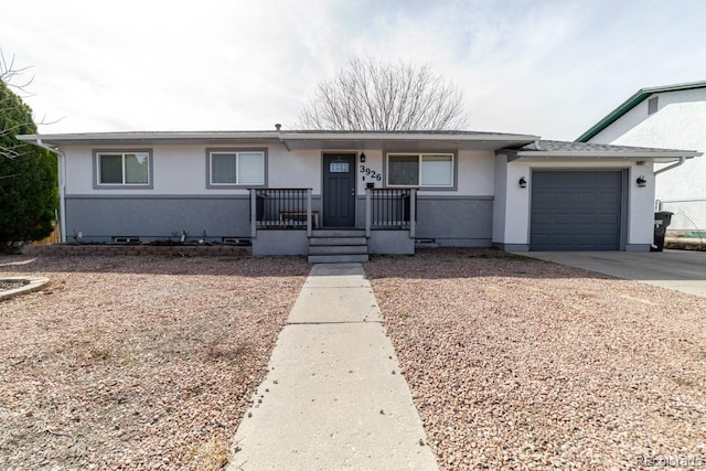 ranch-style home featuring a porch, stucco siding, a garage, crawl space, and driveway