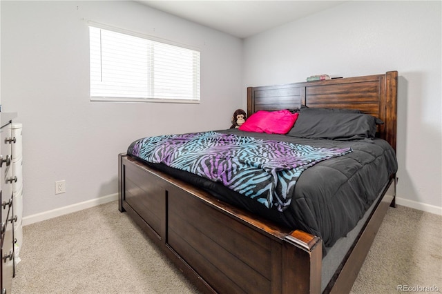 bedroom featuring baseboards and light carpet