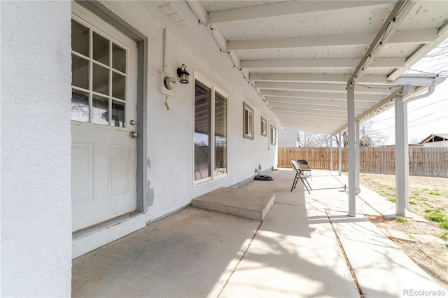 view of patio / terrace featuring fence