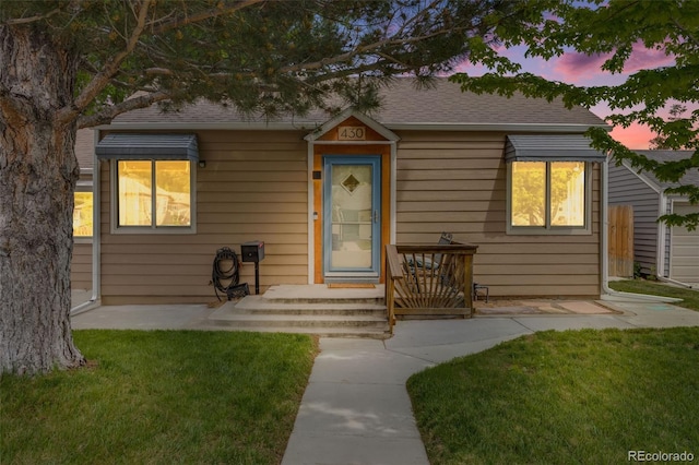 430 Osceola St, Denver, CO 80204 - bungalow-style home with a lawn and roof with shingles