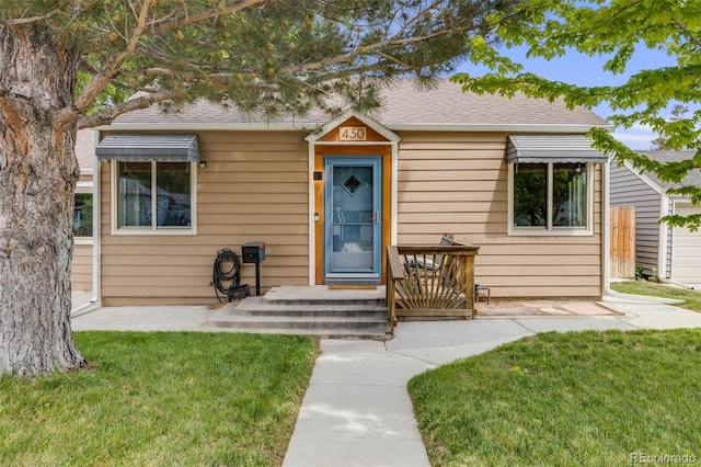 430 Osceola St, Denver, CO 80204 - view of front of house with a front lawn and a shingled roof