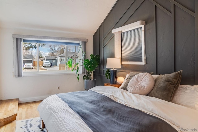 430 Osceola St, Denver, CO 80204 - bedroom with wood finished floors, baseboards, and vaulted ceiling