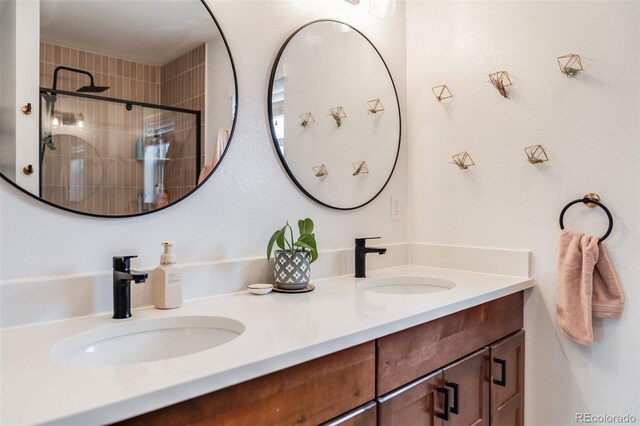 430 Osceola St, Denver, CO 80204 - bathroom featuring double vanity and tiled shower