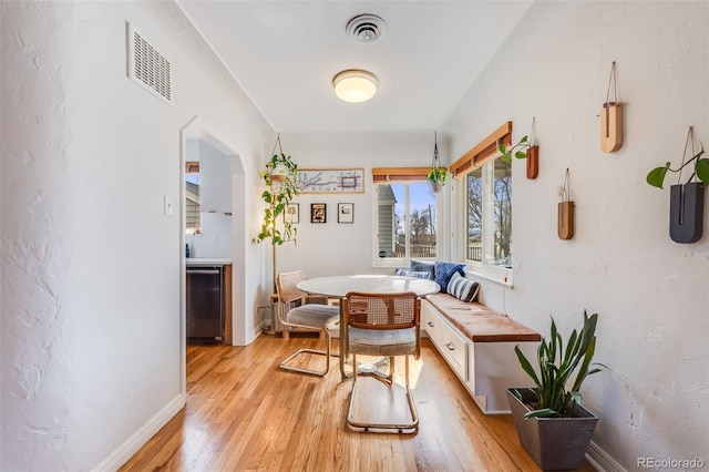 430 Osceola St, Denver, CO 80204 - dining area with breakfast area, light wood finished floors, and baseboards