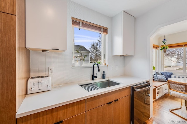 430 Osceola St, Denver, CO 80204 - kitchen with a sink, dishwasher, light countertops, and tasteful backsplash