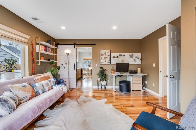 430 Osceola St, Denver, CO 80204 - living area featuring healthy amount of natural light, light wood finished floors, attic access, a desk, and recessed lighting