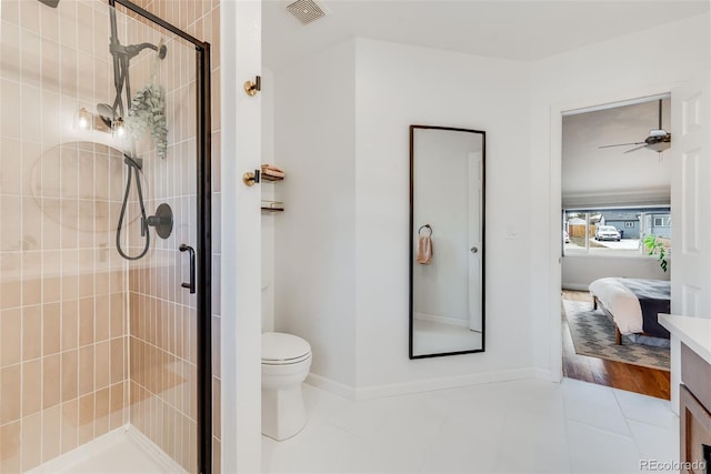 430 Osceola St, Denver, CO 80204 - full bath featuring toilet, a stall shower, tile patterned flooring, and baseboards