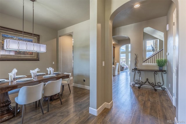 3012 Cathedral Park Vw, Colorado Springs, CO 80904 - dining space with arched walkways and dark wood-type flooring
