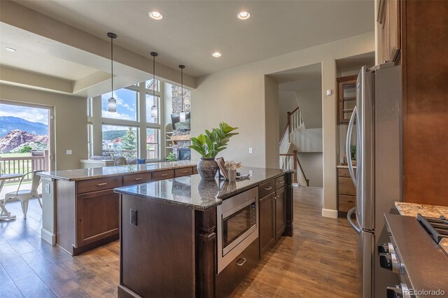 3012 Cathedral Park Vw, Colorado Springs, CO 80904 - kitchen featuring stainless steel appliances, a center island, dark wood-type flooring, recessed lighting, and decorative light fixtures