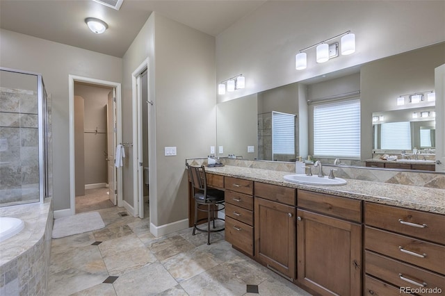 3012 Cathedral Park Vw, Colorado Springs, CO 80904 - bathroom with vanity, a tile shower, and tiled bath