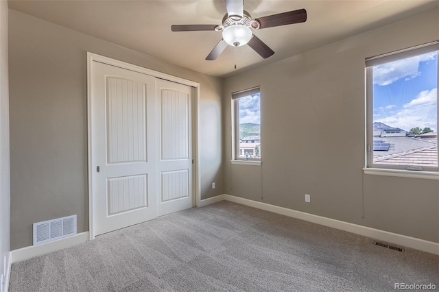 3012 Cathedral Park Vw, Colorado Springs, CO 80904 - unfurnished bedroom featuring carpet, a closet, and a ceiling fan