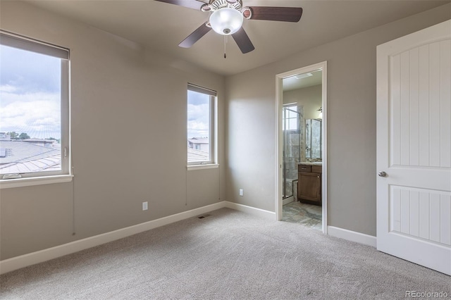 3012 Cathedral Park Vw, Colorado Springs, CO 80904 - unfurnished bedroom with light carpet, ensuite bathroom, and ceiling fan