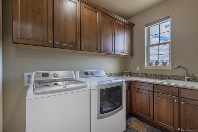 3012 Cathedral Park Vw, Colorado Springs, CO 80904 - laundry area featuring cabinet space, washing machine and clothes dryer, and dark stone finish flooring