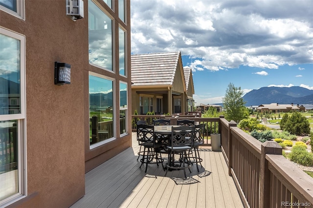 3012 Cathedral Park Vw, Colorado Springs, CO 80904 - wooden terrace featuring outdoor dining space and a mountain view