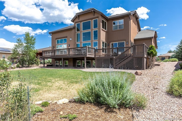 3012 Cathedral Park Vw, Colorado Springs, CO 80904 - rear view of property featuring a wooden deck, stucco siding, a yard, and stairs