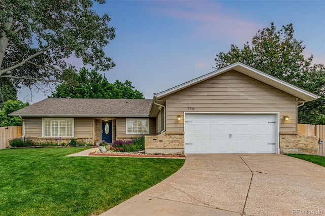 7719 S Jackson Cir, Centennial, CO 80122 - single story home featuring brick siding, concrete driveway, and a garage