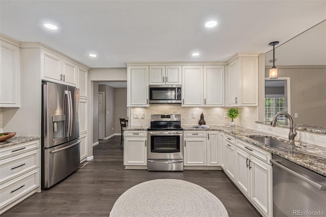7719 S Jackson Cir, Centennial, CO 80122 - kitchen with stainless steel appliances, light stone counters, decorative backsplash, dark wood-style floors, and recessed lighting