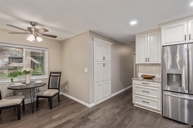 7719 S Jackson Cir, Centennial, CO 80122 - kitchen with stainless steel refrigerator with ice dispenser, ceiling fan, dark wood-style floors, backsplash, and white cabinetry