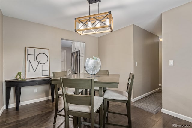 7719 S Jackson Cir, Centennial, CO 80122 - dining area featuring dark wood-type flooring and baseboards