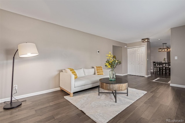 7719 S Jackson Cir, Centennial, CO 80122 - living area featuring dark wood-style floors and a chandelier
