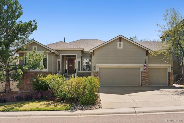 8528 Winter Berry Dr, Castle Pines, CO 80108 - view of front facade with a garage, stone siding, concrete driveway, and a shingled roof