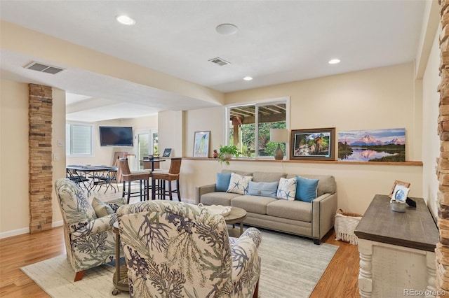 8528 Winter Berry Dr, Castle Pines, CO 80108 - living room with a wealth of natural light, light wood finished floors, and visible vents