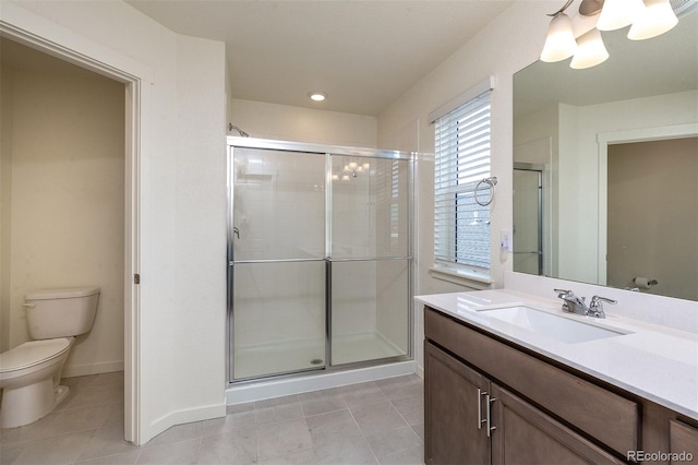 bathroom with vanity, toilet, tile patterned flooring, and an enclosed shower