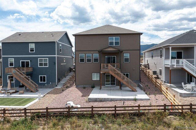 rear view of property featuring a patio