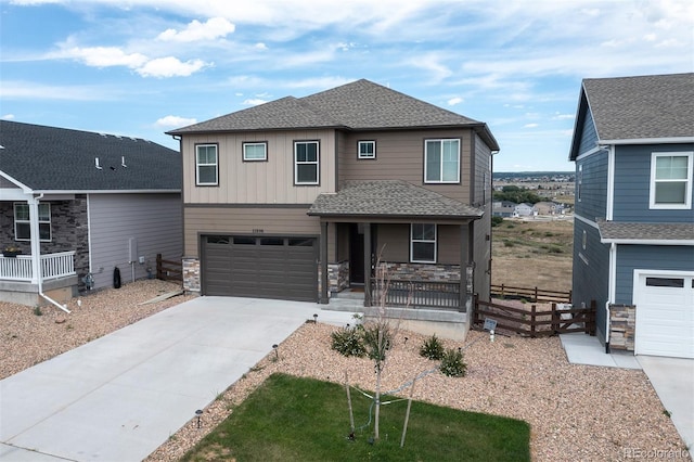 view of front of home with covered porch and a garage