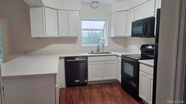 18531 E Tanforan Pl, Aurora, CO 80015 - kitchen featuring black appliances, a sink, white cabinets, dark wood-style floors, and light countertops