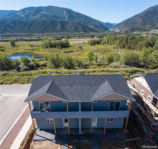 birds eye view of property featuring a mountain view