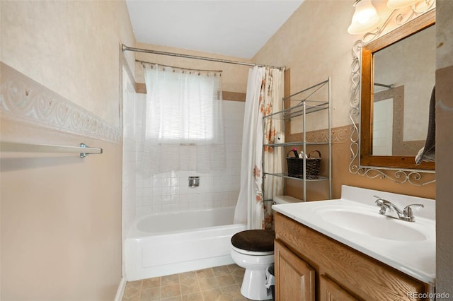 full bathroom featuring shower / bath combo with shower curtain, toilet, vanity, and tile patterned flooring