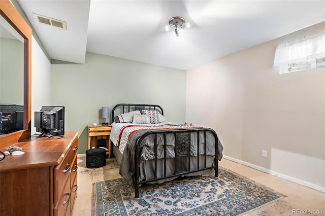 bedroom featuring visible vents, baseboards, and concrete flooring