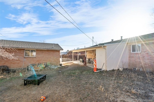 back of property with brick siding