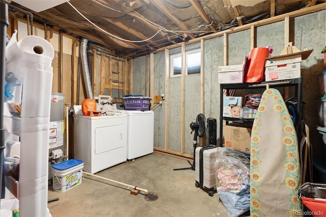 below grade area featuring washer and dryer and water heater