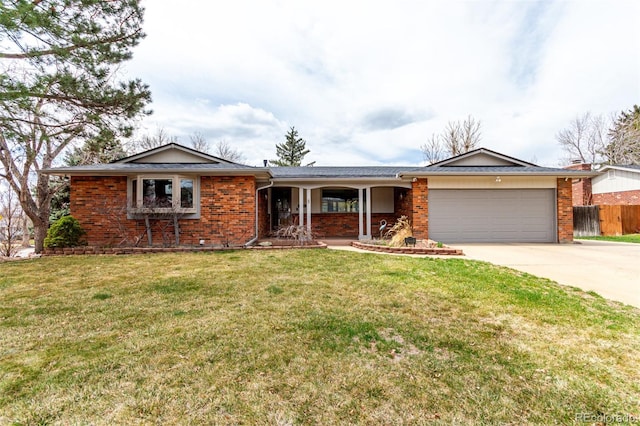 699 S Oswego St, Aurora, CO 80012 - ranch-style home with brick siding, an attached garage, and driveway