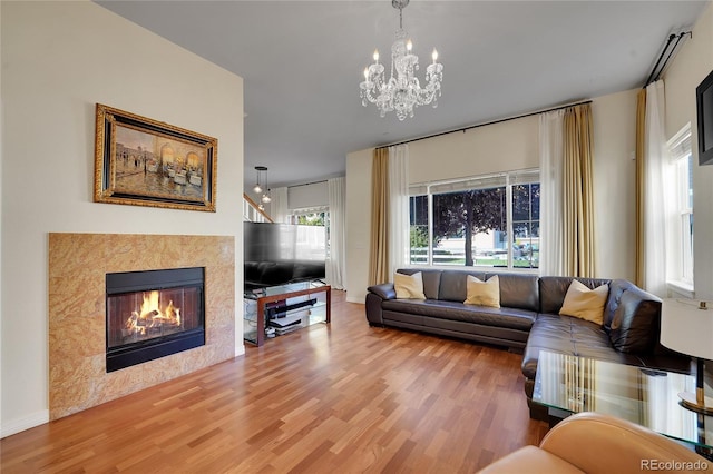 living room featuring hardwood / wood-style flooring and a chandelier