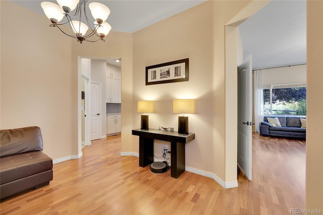 interior space featuring light hardwood / wood-style flooring and a chandelier