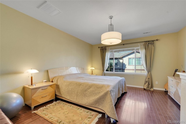 bedroom featuring dark wood-type flooring