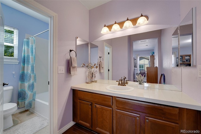 full bathroom with vanity, toilet, and shower / bath combo with shower curtain