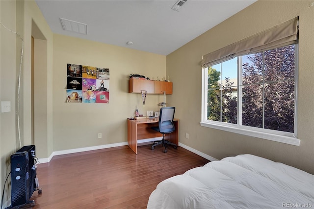 bedroom featuring dark hardwood / wood-style floors