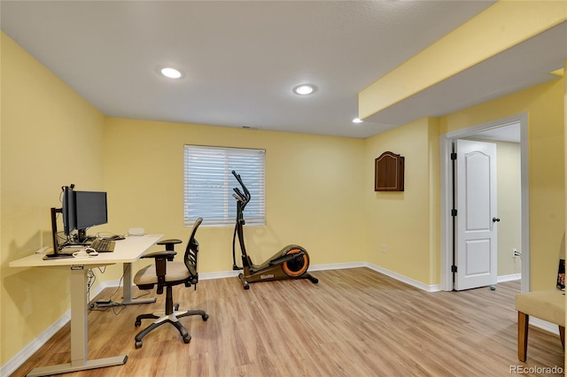 office area with light hardwood / wood-style floors