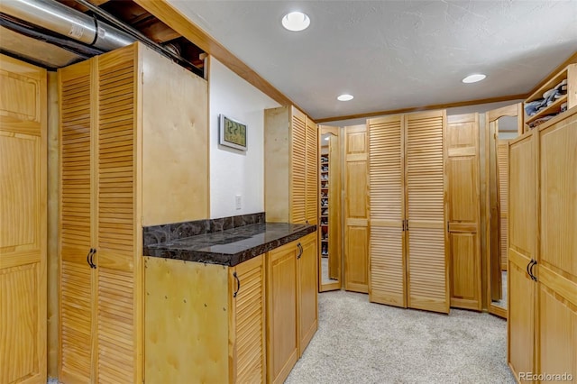 hallway with light carpet and recessed lighting