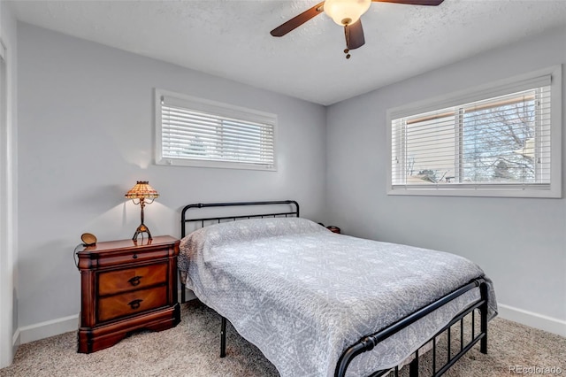 bedroom with carpet flooring, baseboards, and ceiling fan