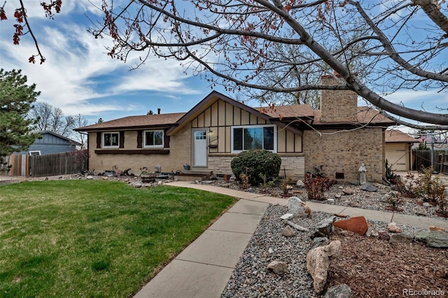 3630 W Saratoga Ave, Littleton, CO 80123 - view of front of property with a chimney, board and batten siding, brick siding, and a shingled roof
