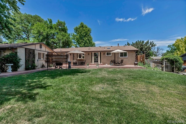 3630 W Saratoga Ave, Littleton, CO 80123 - back of house featuring a patio area, brick siding, and entry steps