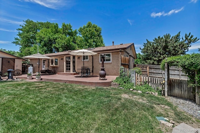 3630 W Saratoga Ave, Littleton, CO 80123 - back of house with brick siding and a patio area